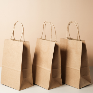 Three paper carrier bags with handles
